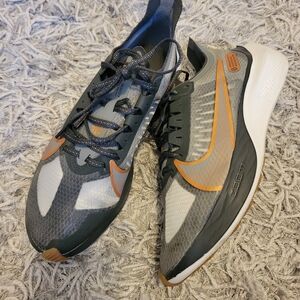 Nike Gravity Gray and Orange Running Shoes.